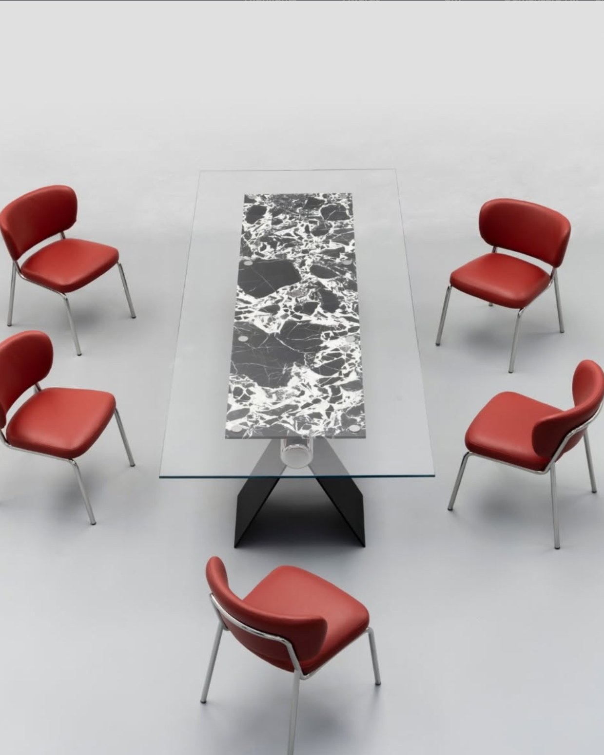 HINGE glass and stone table with red chairs