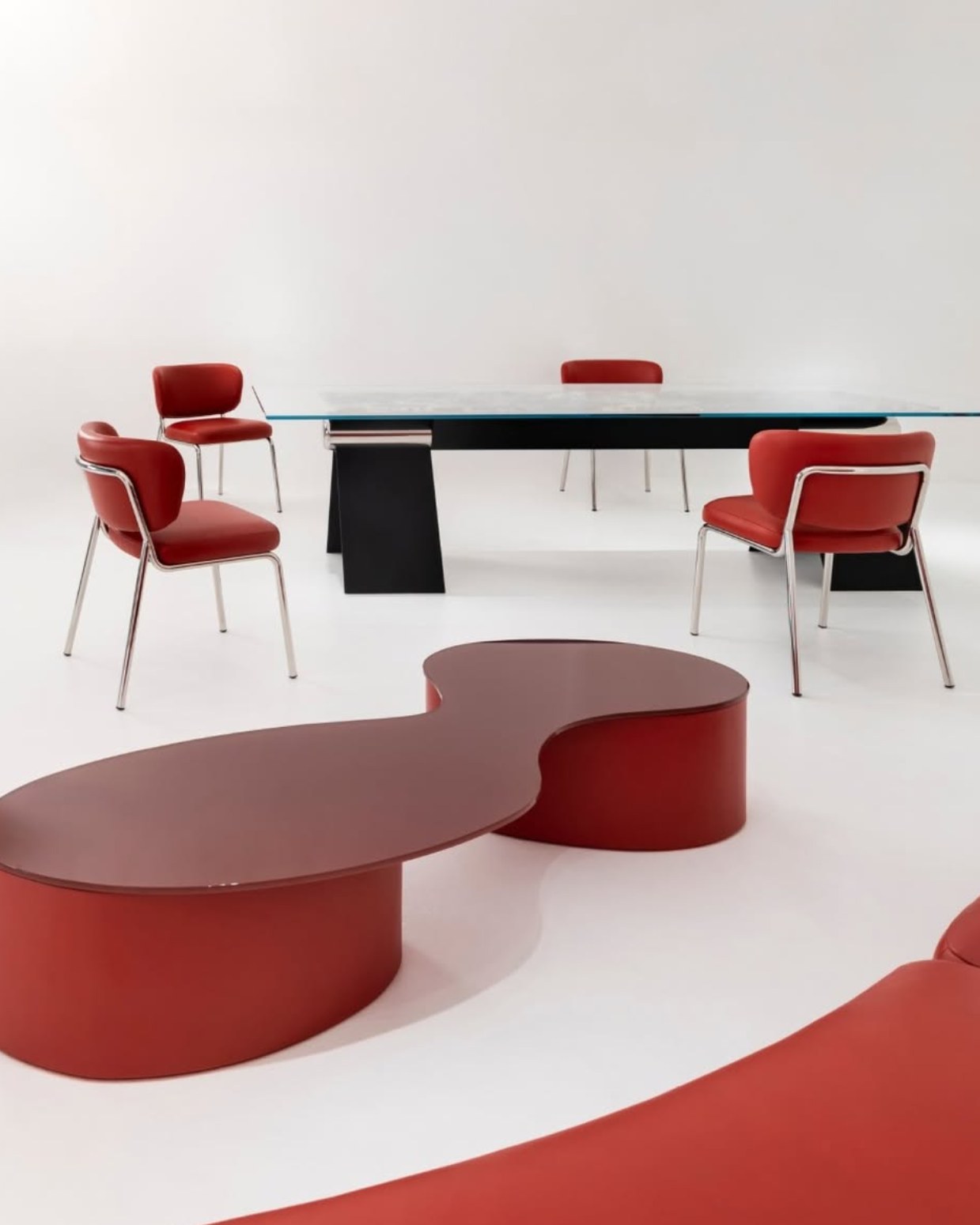 Vertier collection with sculptural red furniture and HINGE table